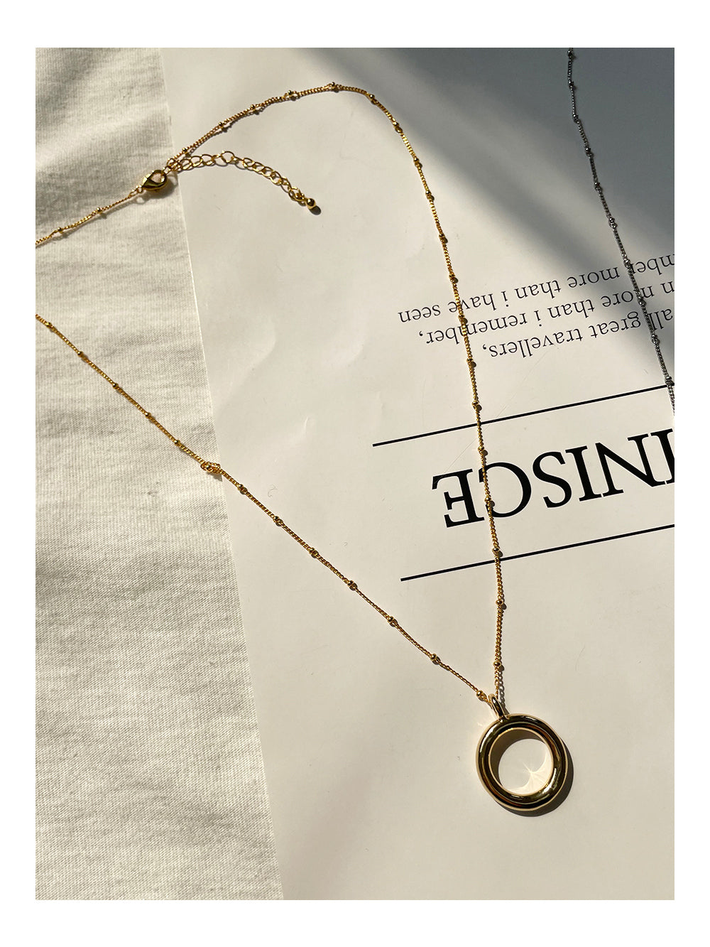 Elegant Circular Pendant Necklace in Gold and Silver